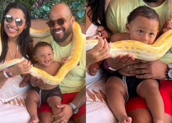 Bebê aproveita foto com cobra durante passeio e tenta morder animal